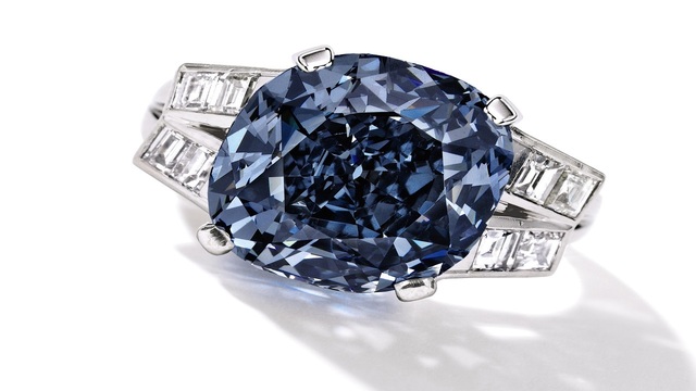 This undated photo provided by Sothebys shows the 9.54 carat blue diamond ring worn for decades by child star-turned-ambassador Shirley Temple, which is going up for auction on April 19, 2016 by Sotheby's in New York.  (Sotheby's via AP)